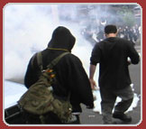 Protestors kick tear gas canister